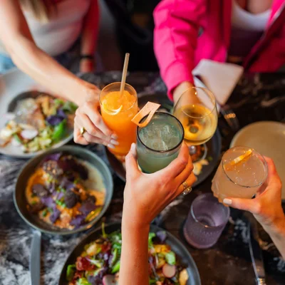 Friends raising drinks in a toast